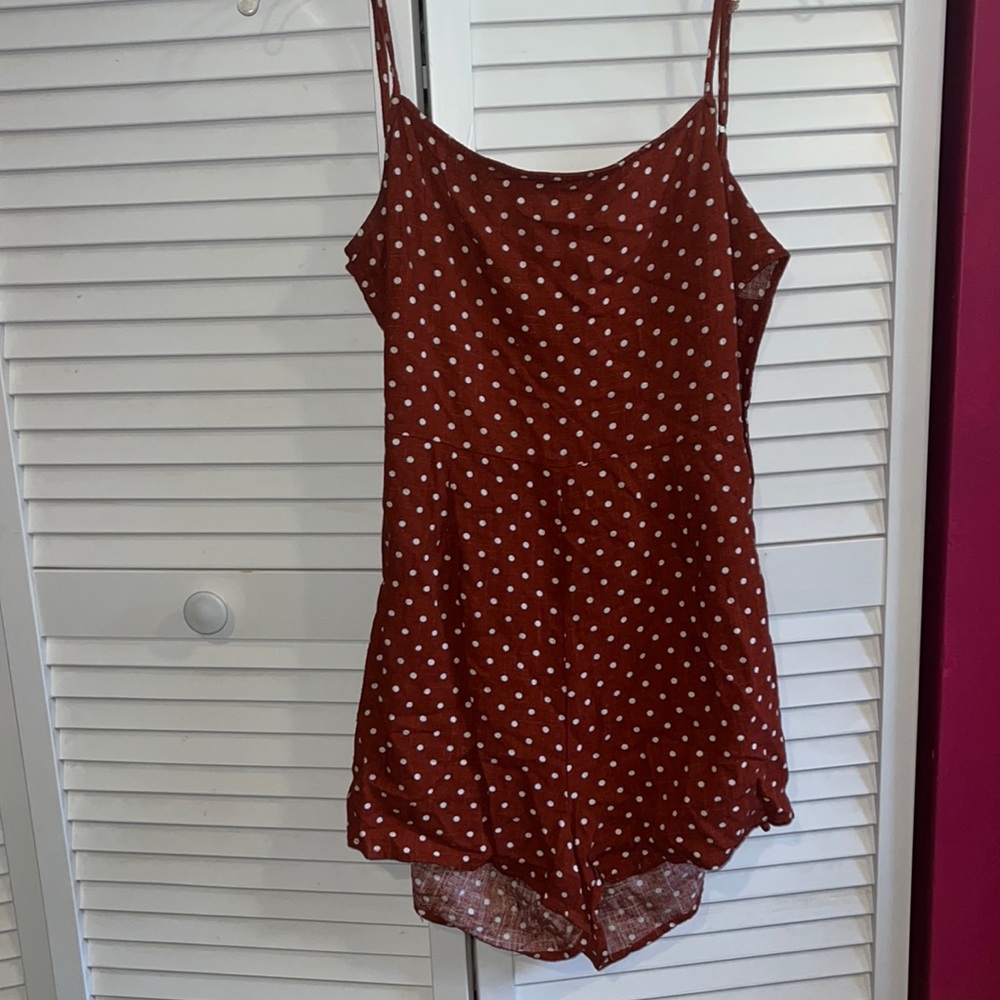 rusty orange polka dot romper with tie back